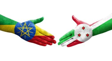 Ellerinde Burundi ve Etiyopya bayrakları arasında el sıkışma, izole şeffaf görüntü.