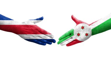Ellerinde Burundi ve Kosta Rika bayrakları arasında el sıkışma, izole şeffaf görüntü.