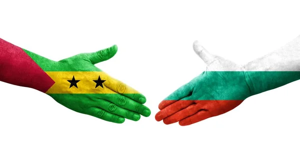 stock image Handshake between Bulgaria and Sao Tome and Principe flags painted on hands, isolated transparent image.