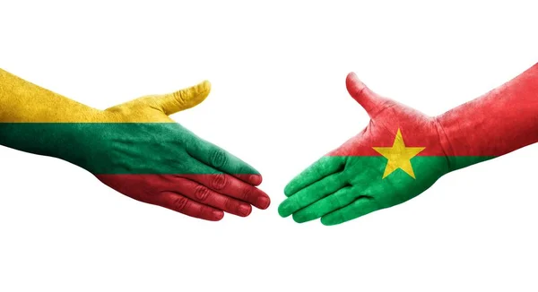 stock image Handshake between Burkina Faso and Lithuania flags painted on hands, isolated transparent image.