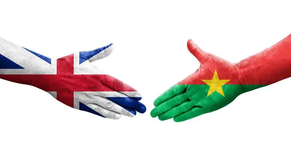 stock image Handshake between Burkina Faso and Great Britain flags painted on hands, isolated transparent image.