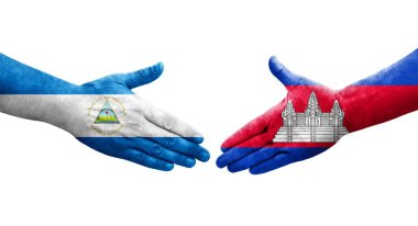 Kamboçya ve Nikaragua bayrakları arasında el sıkışma, izole şeffaf görüntü.