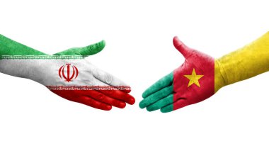 Kamerun ve İran bayrakları arasındaki el sıkışma, izole edilmiş şeffaf görüntü.
