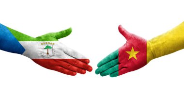 Kamerun ve Ekvator Gine bayrakları arasındaki el sıkışma, izole şeffaf görüntü.