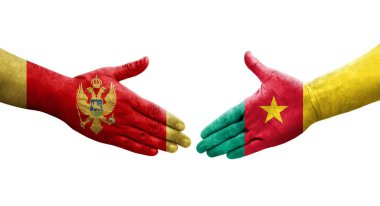 Kamerun ve Karadağ bayrakları arasındaki el sıkışma, izole edilmiş şeffaf görüntü.