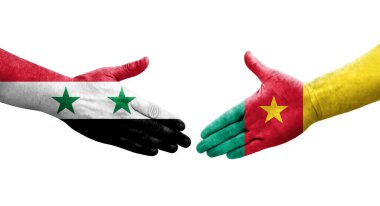 Kamerun ve Suriye bayrakları arasında el sıkışma, izole edilmiş şeffaf görüntü.