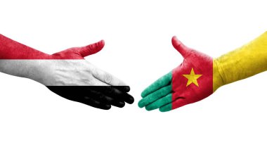 Kamerun ve Yemen bayrakları arasındaki el sıkışma ellerinde resmedilmiş şeffaf görüntü.