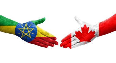 Ellerinde Kanada ve Etiyopya bayrakları arasında el sıkışma, izole şeffaf görüntü.