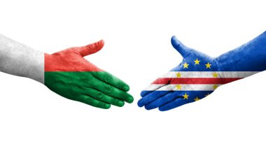 Cape Verde ve Madagaskar bayrakları arasındaki el sıkışma, izole şeffaf görüntü.