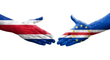 Cape Verde ve Kosta Rika bayrakları arasında el sıkışma, izole şeffaf görüntü.