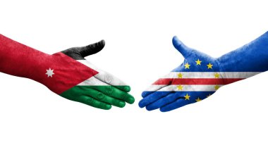 Cape Verde ve Ürdün bayrakları arasında el sıkışma elleri boyalı, izole şeffaf görüntü.