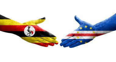 Cape Verde ile Uganda bayrakları arasındaki el sıkışma, izole şeffaf görüntü.