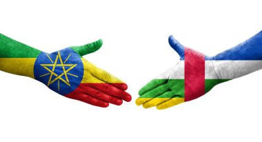 Orta Afrika Cumhuriyeti ile Etiyopya bayrakları arasındaki el sıkışma, izole şeffaf görüntü.