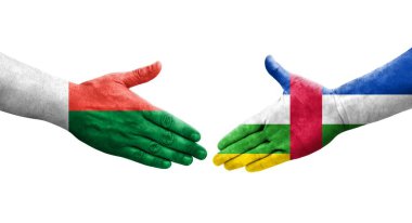 Orta Afrika Cumhuriyeti ile Madagaskar bayrakları arasındaki el sıkışma, izole şeffaf görüntü.