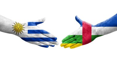 Orta Afrika Cumhuriyeti ve Uruguay bayrakları arasındaki el sıkışma, izole şeffaf görüntü.