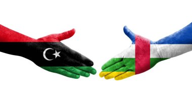 Orta Afrika Cumhuriyeti ile Libya bayrakları arasındaki el sıkışma, izole edilmiş şeffaf görüntü.