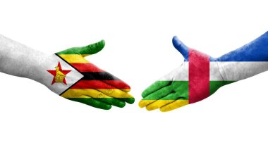 Orta Afrika Cumhuriyeti ve Zimbabwe bayrakları arasındaki el sıkışma, izole şeffaf görüntü.