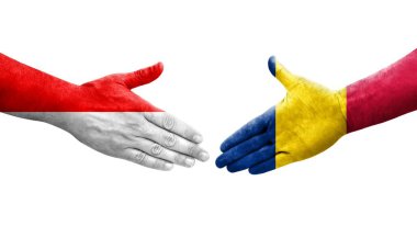 Chad ve Endonezya bayrakları arasındaki el sıkışma ellerinde resmedilmiş şeffaf görüntü.