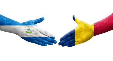 Chad ve Nikaragua bayrakları arasındaki el sıkışma ellerinde resmedilmiş şeffaf bir görüntü.