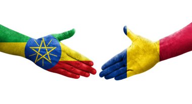 Chad ve Etiyopya bayrakları arasındaki el sıkışma ellerinde resmedilmiş şeffaf görüntü.