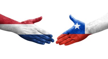 Ellerinde Şili ve Hollanda bayrakları arasında el sıkışma, izole şeffaf görüntü.
