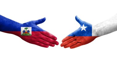 Ellerinde Şili ve Haiti bayrakları arasında el sıkışma, izole şeffaf görüntü.