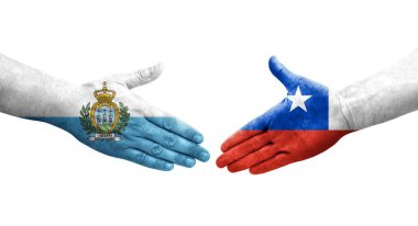 Şili ve San Marino bayrakları arasında el sıkışma, izole şeffaf görüntü.