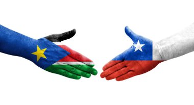 Şili ve Güney Sudan bayrakları arasındaki el sıkışma ellerinde resmedilmiş şeffaf görüntü.