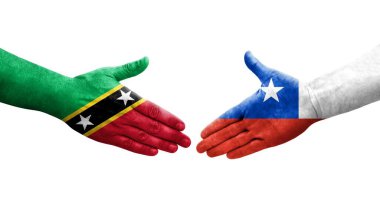 Şili ile Saint Kitts ve Nevis bayrakları arasındaki el sıkışma, izole şeffaf görüntü.