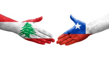 Şili ve Lübnan bayrakları arasındaki el sıkışma ellerinde resmedilmiş şeffaf görüntü.