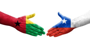 Şili ve Gine Bissau bayrakları arasındaki el sıkışma ellerinde izole şeffaf görüntü.