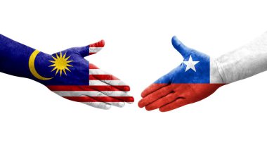 Ellerinde Şili ve Malezya bayrakları arasında el sıkışma, izole şeffaf görüntü.