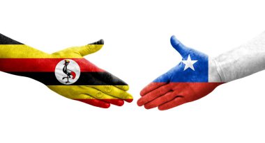 Ellerinde Şili ve Uganda bayrakları arasında el sıkışma, izole şeffaf görüntü.