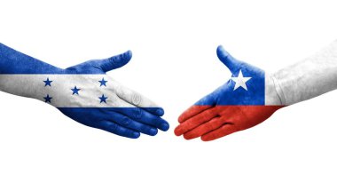 Ellerinde Şili ve Honduras bayrakları arasında el sıkışma, izole şeffaf görüntü.