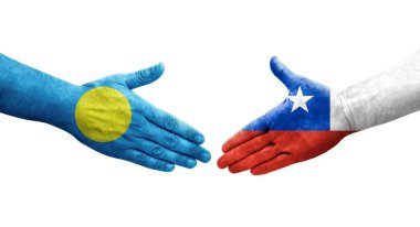Şili ve Palau bayrakları arasındaki el sıkışma ellerinde resmedilmiş şeffaf görüntü.
