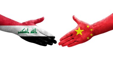 Çin ve Irak bayrakları arasında el sıkışma, izole şeffaf görüntü.