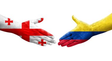 Ellerinde Kolombiya ve Gürcistan bayrakları arasında el sıkışma, izole şeffaf görüntü.