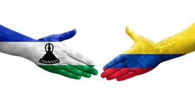 Ellerinde Kolombiya ve Lesotho bayrakları arasında el sıkışma, izole şeffaf görüntü.
