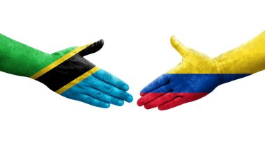 Kolombiya ve Tanzanya bayrakları arasındaki el sıkışma ellerinde resmedilmiş şeffaf görüntü.
