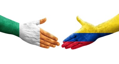Kolombiya ve İrlanda bayrakları arasındaki el sıkışma, izole edilmiş şeffaf görüntü.