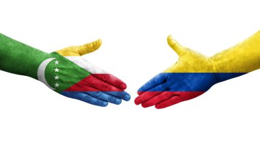 Kolombiya ve Komoros bayrakları arasındaki el sıkışma ellerinde resmedilmiş şeffaf görüntü.