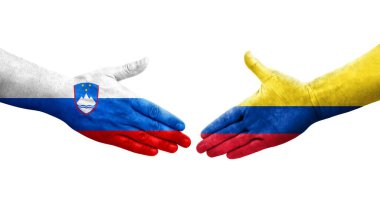 Ellerinde Kolombiya ve Slovenya bayrakları arasında el sıkışma, izole şeffaf görüntü.