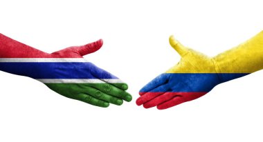 Kolombiya ve Gambiya bayrakları arasında el sıkışma, izole şeffaf görüntü.