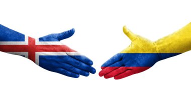 Kolombiya ve İzlanda bayrakları arasında el sıkışma, izole edilmiş şeffaf görüntü.