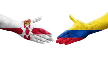 Kolombiya ve Kuzey İrlanda bayrakları arasında el sıkışma, izole şeffaf görüntü.