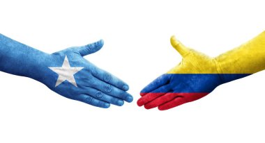 Kolombiya ve Somali bayrakları arasındaki el sıkışma ellerinde resmedilmiş şeffaf görüntü.