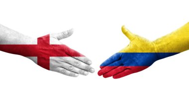 Kolombiya ve İngiltere arasındaki el sıkışma ellerinde bayraklar, izole edilmiş şeffaf görüntü.