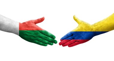 Kolombiya ve Madagaskar bayrakları arasındaki el sıkışma ellerinde resmedilmiş şeffaf görüntü.