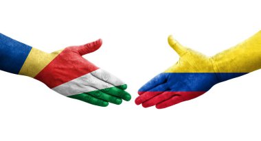Kolombiya ve Seyşel bayrakları arasındaki el sıkışma ellerinde izole şeffaf görüntü.