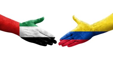 Kolombiya ve BAE bayrakları arasında el sıkışma, izole saydam görüntü.